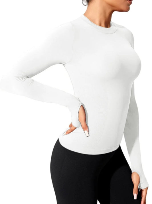 Elevate your workout wardrobe with our Long Sleeve Yoga Shirt! This seamless top is crafted from breathable, quick-dry fabric, ensuring you stay cool during intense sessions. Its stylish fit hugs your body for ultimate comfort and freedom of movement, making it perfect