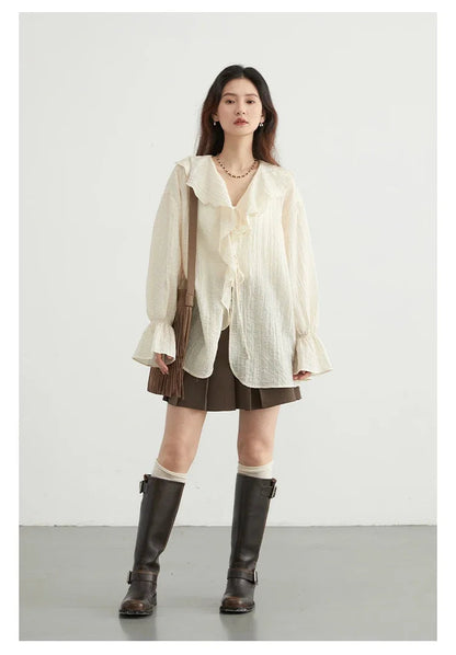 Chic Ruffled V-Neck Lace-Up Blouse in a versatile color, designed for the modern woman. Featuring a beautiful ruffled neckline and playful lace-up detailing, this loose-fit blouse ensures comfort and breathability for warmer days. Perfect for transitioning