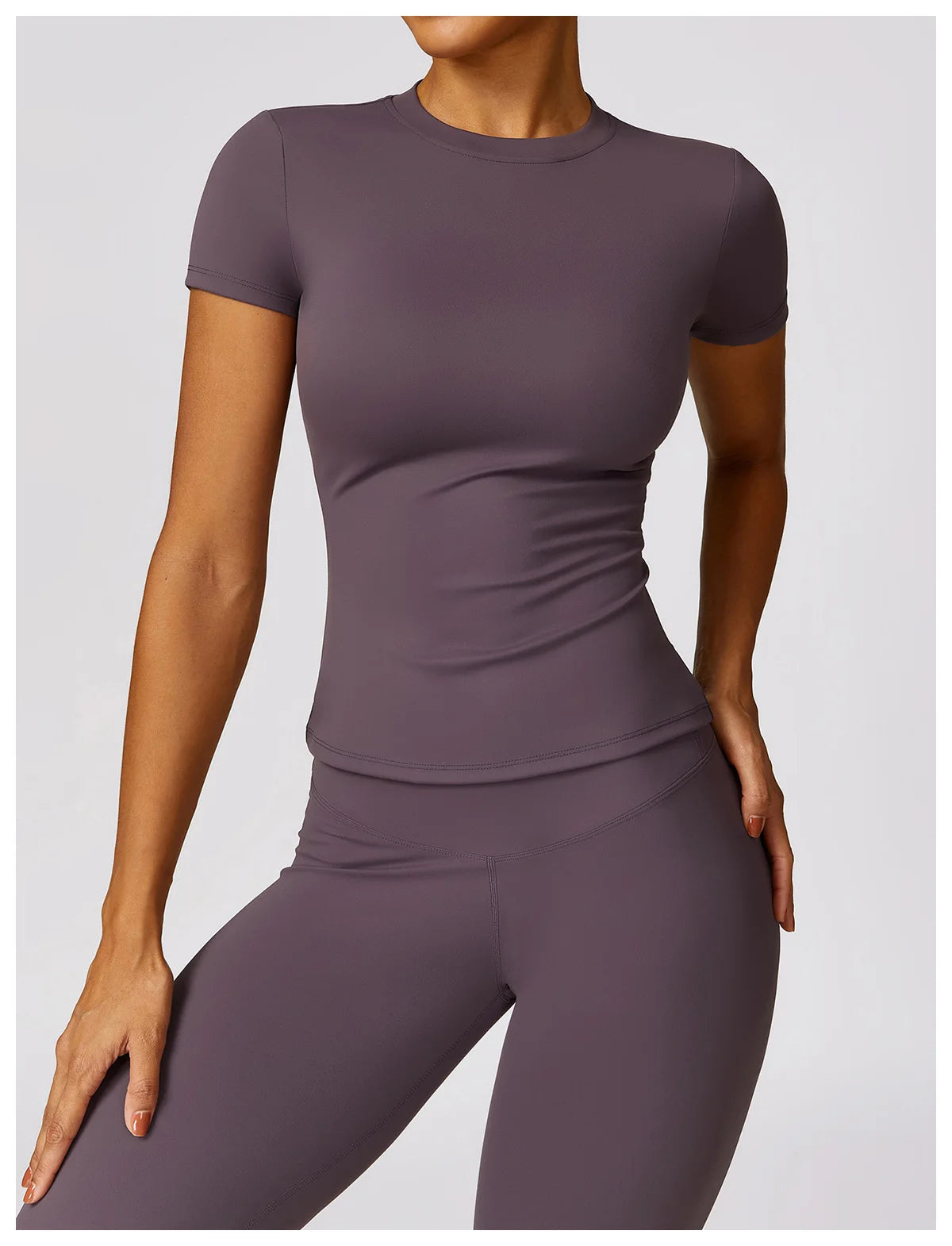 Elevate your workout wardrobe with the NCLAGEN Short Sleeve T-Shirt, crafted from lightweight, breathable nylon for ultimate comfort. This fitted gym wear features a flattering round neck design, making it perfect for yoga, running, or casual outings. Available in