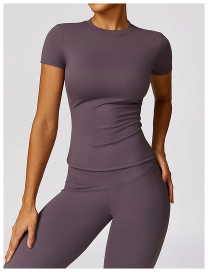 Elevate your workout wardrobe with the NCLAGEN Short Sleeve T-Shirt, crafted from lightweight, breathable nylon for ultimate comfort. This fitted gym wear features a flattering round neck design, making it perfect for yoga, running, or casual outings. Available in