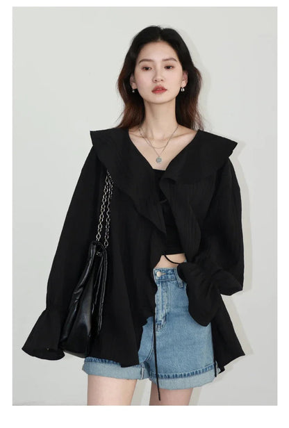 Chic Ruffled V-Neck Lace-Up Blouse, perfect for spring and summer styling. This blouse features a beautiful ruffled neckline and playful lace-up detailing, offering an adjustable fit. With its loose fit design, it ensures breathability and comfort