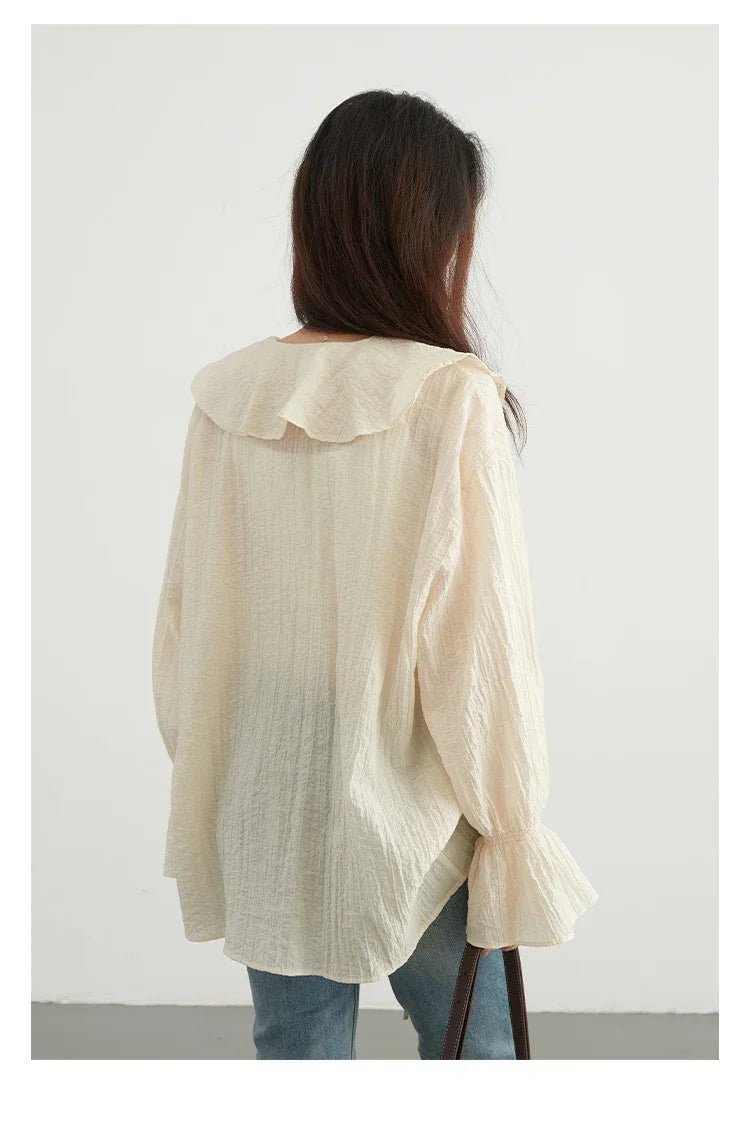 Effortlessly chic Ruffled V-Neck Lace-Up Blouse, designed for the modern woman. Featuring a beautiful ruffled neckline and playful lace-up detailing, this loose-fit blouse offers breathability and comfort for warm days. Available in versatile colors,