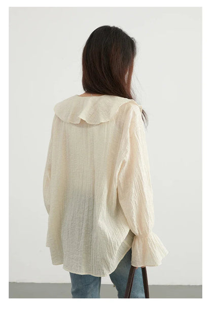 Effortlessly chic Ruffled V-Neck Lace-Up Blouse, designed for the modern woman. Featuring a beautiful ruffled neckline and playful lace-up detailing, this loose-fit blouse offers breathability and comfort for warm days. Available in versatile colors,