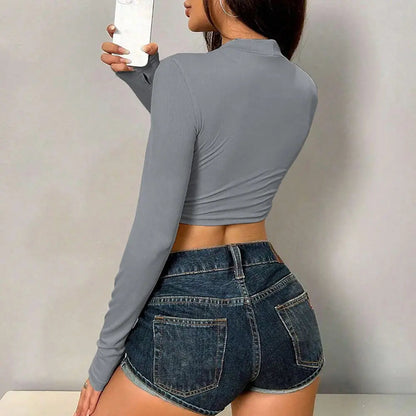 Elevate your autumn wardrobe with our Cropped Long Sleeve Hollow Out T-Shirt. This stylish piece features a chic hollow-out design and a flattering cropped silhouette, making it perfect for layering or wearing solo. Crafted from soft, breathable fabric, it ensures comfort