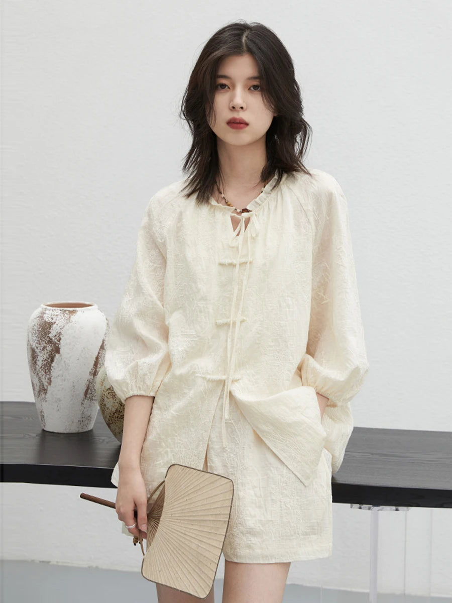 Elegant embroidered Chinese blouse and shorts set, showcasing intricate craftsmanship and a contemporary design. Made from soft, breathable fabric for ultimate comfort, this relaxed fit outfit flatters every silhouette. Perfect for chic summer outings or casual gatherings, it's a must-have addition to