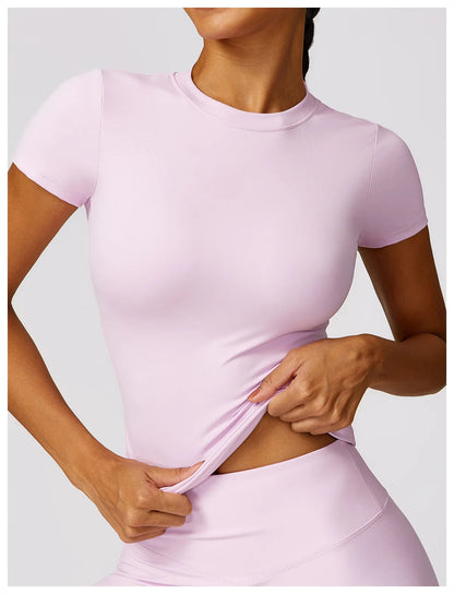 Elevate your activewear collection with the NCLAGEN Short Sleeve T-Shirt, crafted from lightweight, breathable nylon for maximum comfort. This stylish gym tee features a fitted silhouette and round neck, making it perfect for workouts, yoga sessions, or casual outings