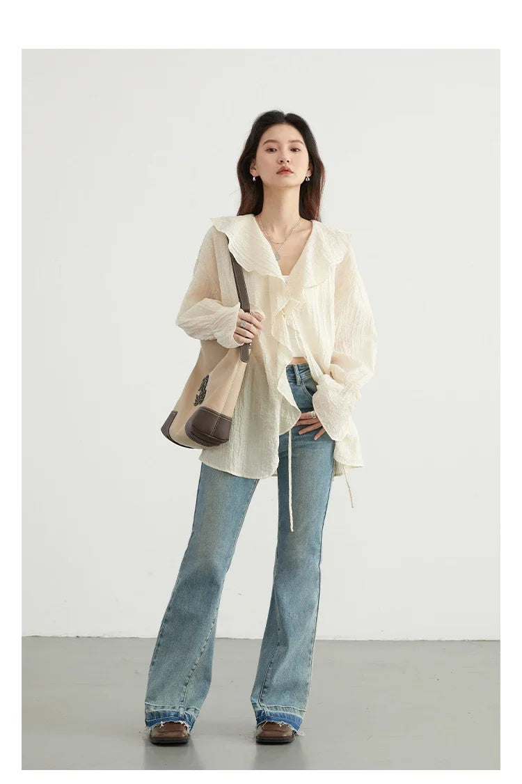 Effortlessly chic Ruffled V-Neck Lace-Up Blouse perfect for spring and summer. This stylish top features a beautiful ruffled neckline and playful lace-up detailing for an adjustable fit. Crafted with a loose fit design for ultimate breathability and comfort