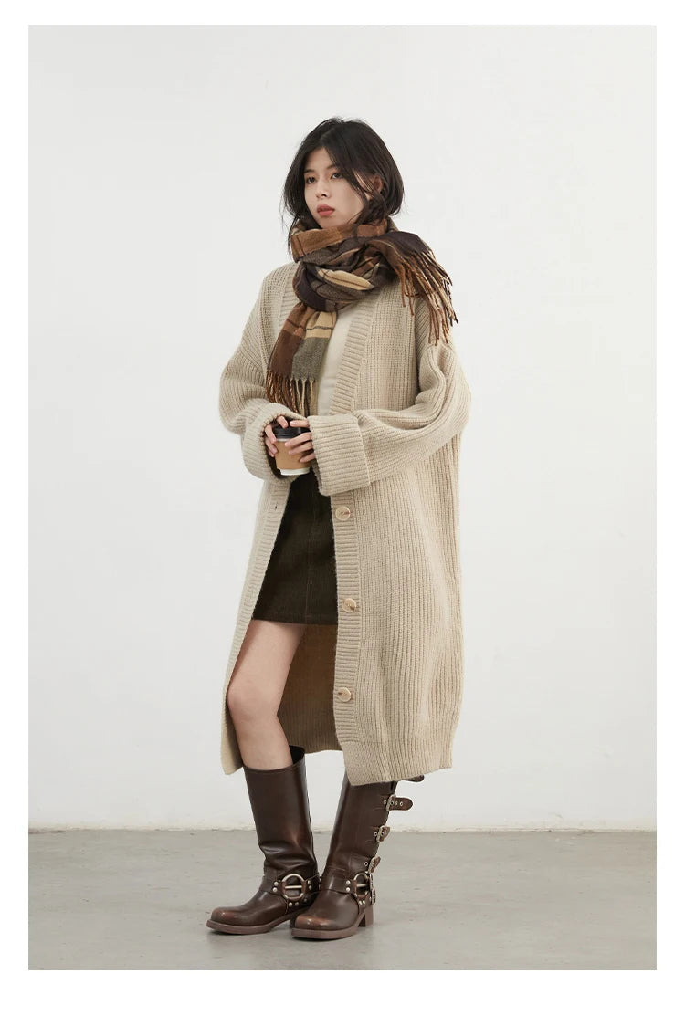 Elevate your wardrobe with the Korean Loose Knitted Cardigan & Long Coat, a perfect blend of comfort and style. Crafted from luxuriously soft knitted fabric, this oversized cardigan offers a relaxed silhouette that flatters every figure. Featuring a timeless design
