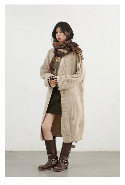 Elevate your wardrobe with the Korean Loose Knitted Cardigan & Long Coat, a perfect blend of comfort and style. Crafted from luxuriously soft knitted fabric, this oversized cardigan offers a relaxed silhouette that flatters every figure. Featuring a timeless design