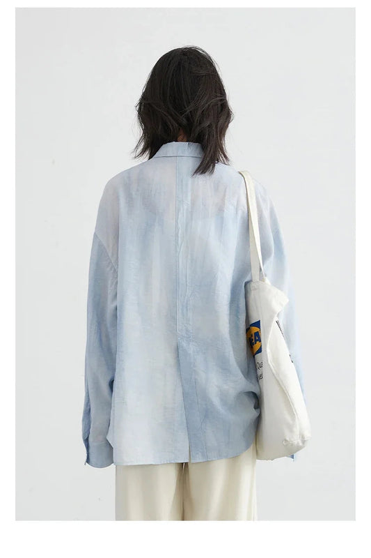 Discover the stylish **Textured Long Sleeve Blouse with Split Collar**, perfect for embracing summer vibes. This trendy top features a vibrant tie-dye pattern and soft, breathable fabric for all-day comfort. The modern split collar and long sleeves make it versatile