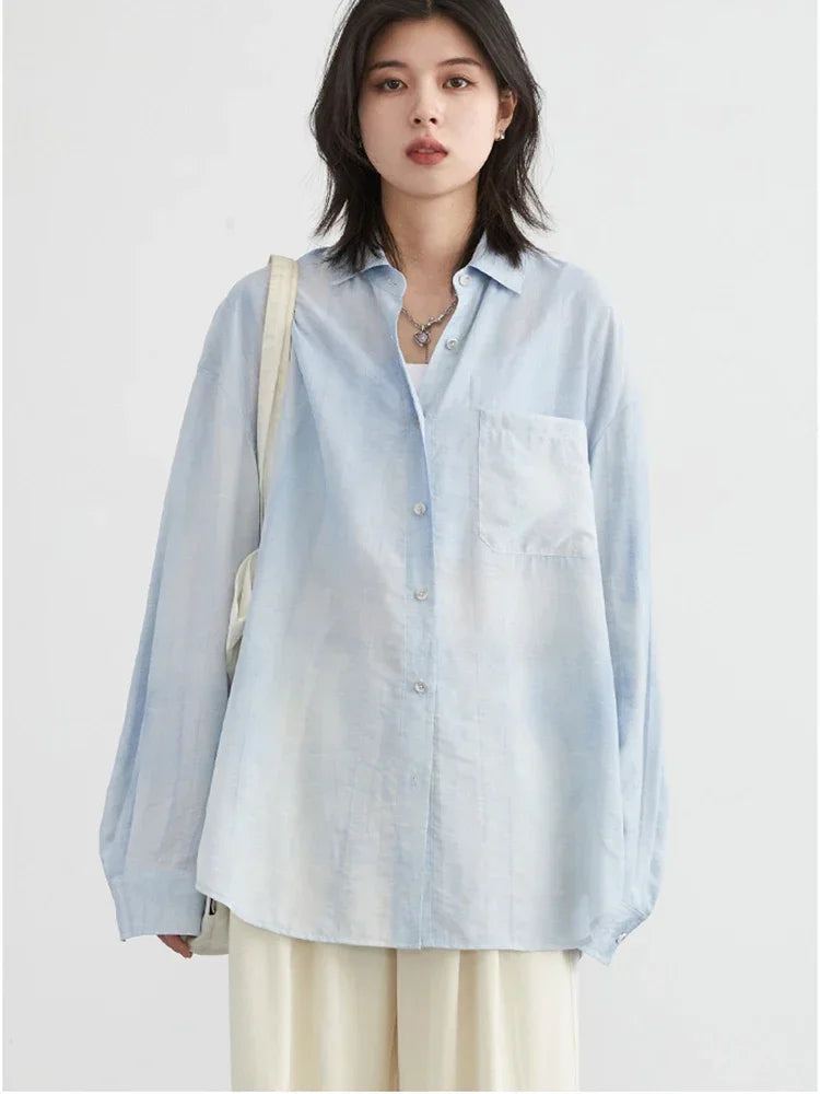 Elevate your summer wardrobe with the Textured Long Sleeve Blouse with Split Collar. This stylish piece showcases a vibrant tie-dye pattern, perfect for adding a playful touch to any outfit. Crafted from soft, breathable fabric, it ensures all-day comfort