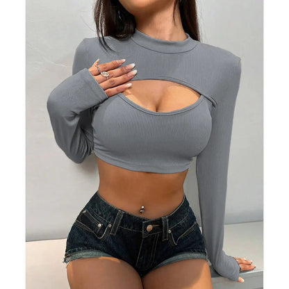 Chic cropped long sleeve hollow-out t-shirt designed for the fashion-forward individual. Crafted from soft, breathable fabric, this trendy top combines comfort and style seamlessly. The unique hollow-out design adds an edgy touch, while the cropped silhouette flatters your figure