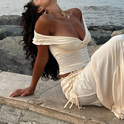 Elevate your summer style with the Gaono Women's Lettuce Trim Crop Top! This chic off-shoulder top features a trendy twist knot design and a flattering fit, perfect for casual outings or special events. Made from soft, stretchy polyester broadcloth