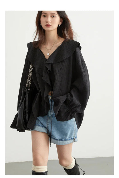 Effortlessly chic Ruffled V-Neck Lace-Up Blouse, perfect for spring and summer. This stylish top features a beautiful ruffled neckline and playful lace-up detailing for an adjustable fit. With its loose design for breathability and versatile color options